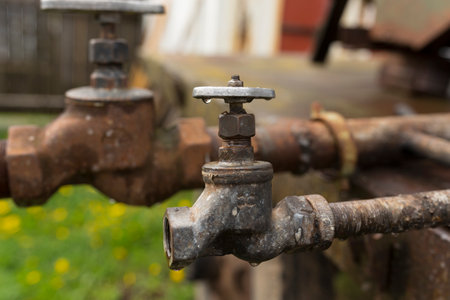 water faucet and water pipes rusty, water sources for farmers fieldsの写真素材