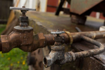 water faucet and water pipes rusty, water sources for farmers fieldsの写真素材