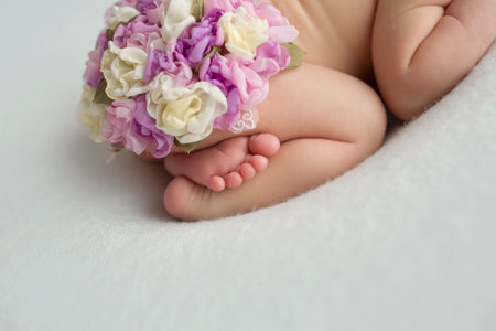 Baby feet. The tiny foot of a newborn in soft selective focus. Image of the soles of the feet.の写真素材
