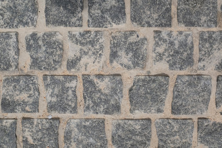 From above, a view of the cobblestone street . The texture of the stone pavement. Granite stones.の写真素材