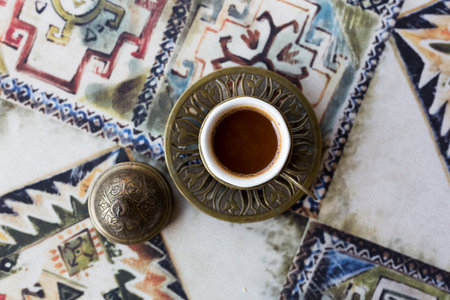 Traditional Turkish coffee. Oriental coffee on the table in a copper cup. Tbilisi, Georgia.の写真素材