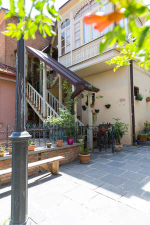 Staircase to the old building in the city of Tbilisi, Georgia. The architecture of the old city. Stone stairs. Wooden colored stairs.の写真素材
