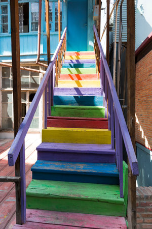 Staircase to the old building in the city of Tbilisi, Georgia. The architecture of the old city. Stone stairs. Wooden colored stairs.の写真素材