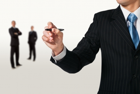 Businessman writing, drawing on the screen. Teamworkの写真素材