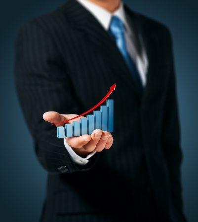Man holds the chart of growthの写真素材