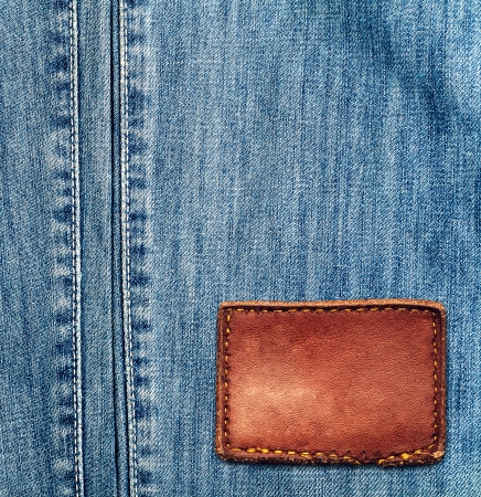 Blue denim jeans texture with empty labelの写真素材