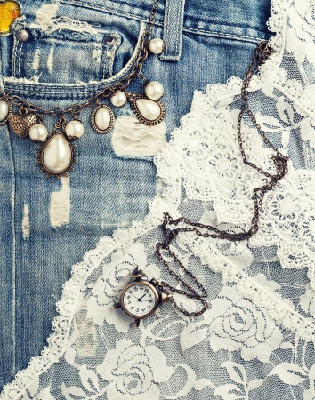 retro background with vintage jewelry and jeans textureの写真素材