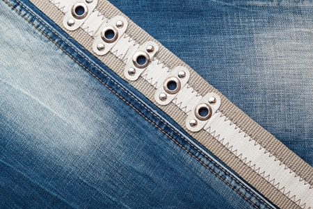 Blue denim jeans texture with a beltの写真素材