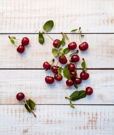 fresh cherries on wooden tableの写真素材