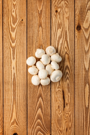 Mushrooms on a wooden backgroundの写真素材