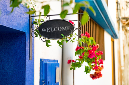 Welcome signboard near a doorの写真素材