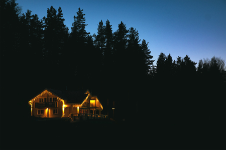 Beautiful house decorated of christmas lights at nightの写真素材