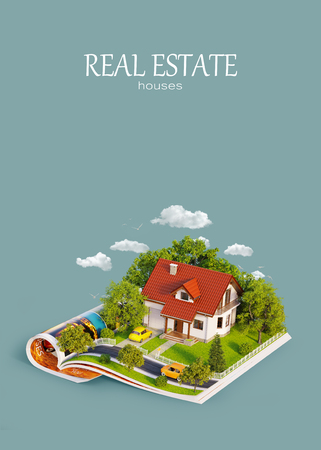 White house of dream with white fence, garden and trees on opened pages of magazine. Unusual 3d illustration. Travel and camping conceptの写真素材