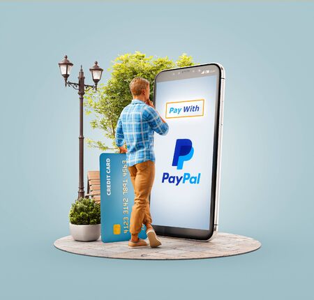 New york, USA - June 04, 2019: 3d illustration of a man with credit card doing online payment using Paypal.のeditorial素材