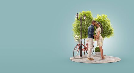 3d illustration of a young beautiful couple in love hugging and looking at each other standing in park. Romantic relationship and family concept. Valentines dayの写真素材