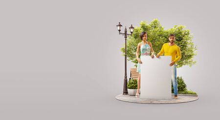 Couple of young people holding an empty white board standing in a park in summer day. Advertisement concept. Unusual 3d illustrationの写真素材