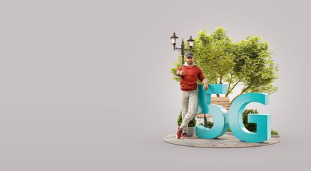 Man standing beside 5G sign and showing thumb up. High-speed Internet 5G standard network wireless signal transmission technology. Unusual 3d illustrationの写真素材