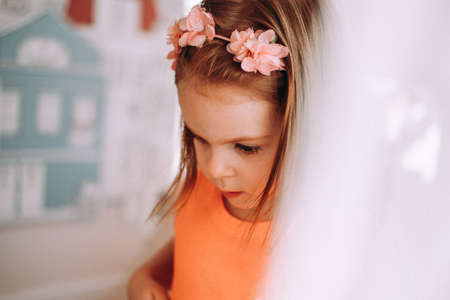 Portrait of a beautiful little girl in her roomの写真素材