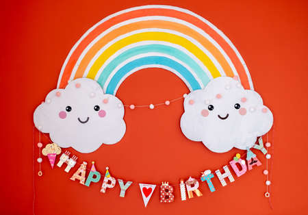 Colorful happy birthday decoration. Rainbow and clouds children birthday decorationの写真素材