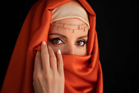 Close Up Portrait Of Beauty Young Muslim Woman In Hijab Looking At Camera.の写真素材