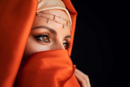 Close Up Portrait Of Beauty Young Muslim Woman In Hijab Looking At Camera.の写真素材
