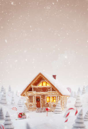 Unusual christmas 3d illustration greeting card. Cute cozy dreamlike Decorated log house decorated at christmas of christmas lights in magical forest.の写真素材