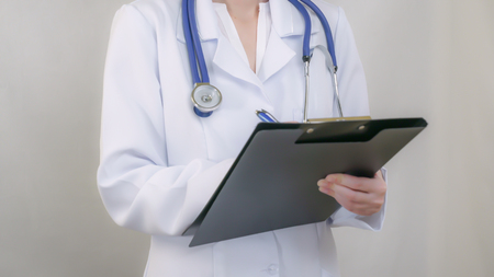 Doctor standing fills the document, staticの写真素材