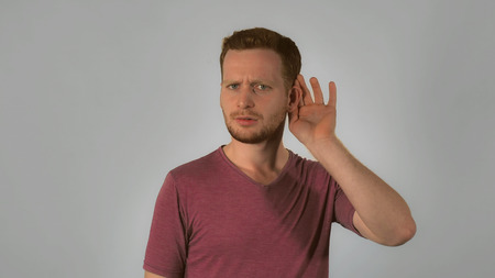 Caucasian Guy With Red Hair Posing Showing Hand Gesture Puts His