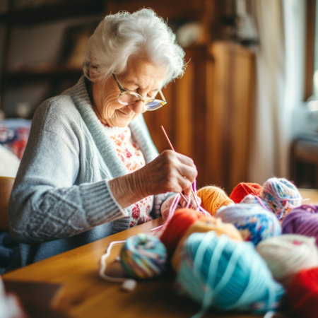 Stock image of an elderly woman knitting at home, crafting and creating Generative AIの素材