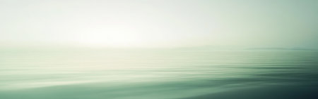 The gentle waves of the ocean blend seamlessly with the soft morning light, creating a serene and tranquil atmosphere just after dawn.の素材