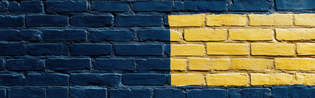 Colorful brick wall features a striking pattern of blue and yellow blocks, adding a lively touch to the surrounding urban landscape. This artistic expression brings vibrancy to the neighborhood.の素材