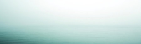 A smooth, minimalist gradient in mint hue softly meets tranquil waters, capturing the essence of calmness and serenity at dawn. The atmosphere is peaceful and soothing.の素材