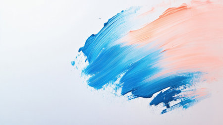 Swirls of blue and peach paint blend artfully across a white canvas, showcasing a moment of creativity and artistic exploration. Ideal for inspiring designers and artists.の素材