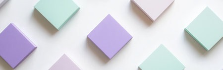Lavender and mint squares are meticulously arranged on a clean, light backdrop, creating a visually pleasing pattern that emphasizes modern simplicity and elegance.の素材