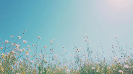 A colorful field of wildflowers sways in the warm breeze, illuminated by the bright sunshine on a beautiful spring day. The scene captures the essence of nature's beauty and tranquility.の素材