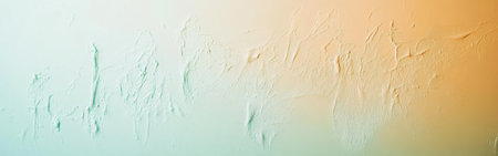 Soft pastel mint gradually transitions into warm amber, creating a tranquil environment. The textured surface adds depth, making it ideal for artistic inspiration or background design.の素材