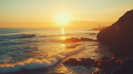 Waves softly lap against the rugged rocks as the sun sets, casting a warm glow around the lighthouse perched on the shore, creating a serene seaside atmosphere.の素材