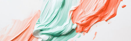 Swirls of green and red paint create a striking contrast against a white canvas, capturing a moment of creativity and artistic exploration in a calm, creative space.の素材