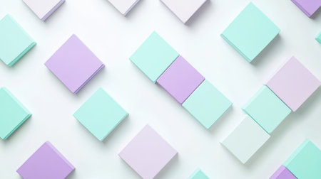 Lavender and mint squares are carefully arranged on a light background, creating a visually pleasing pattern that showcases symmetry and color harmony in an artistic display.の素材