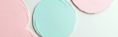 Soft pink and blue circles on a minimalist backdrop display gentle color contrasts. This tranquil setting invites an introspective mood, ideal for creative inspiration.の素材