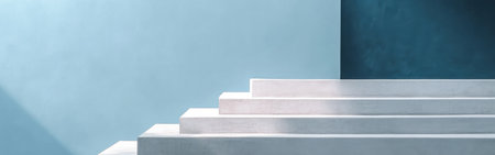 Smooth, minimalist steps in pastel gray shift to a calming blue backdrop, creating a tranquil atmosphere that encourages relaxation and reflection. Light plays softly across the surfaces.の素材
