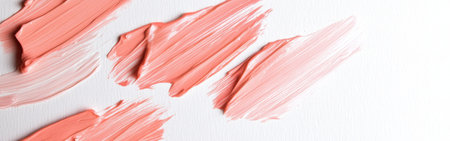 Soft coral and peach paint strokes are applied with precision on a plain, white canvas, showing artistic flair and a minimalist aesthetic. The subtle texture enhances the colors.の素材