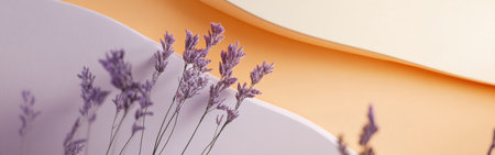 Delicate lavender blooms contrast beautifully with soft amber hues, set against a minimalist backdrop. This arrangement evokes tranquility and aesthetic harmony.の素材