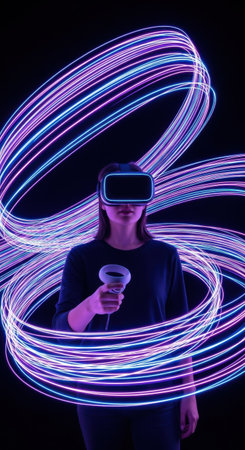 A user stands with a virtual reality headset and controller, surrounded by vibrant light trails in a dark environment. The scene captures the excitement of virtual gaming.の素材
