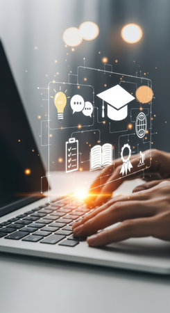 A person is typing on a laptop keyboard with colorful icons floating above, representing education, ideas, and communication. This scene reflects the modern learning environment.の素材