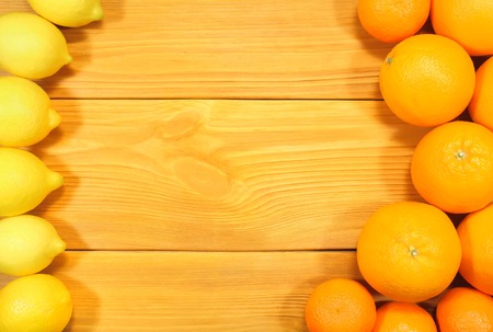 Composition of citrus fruits: oranges, lemons, tangerines, lime and grapefruit on a background of an old rustic table. To design a cooking recipe or menuの写真素材