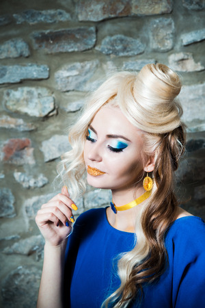 Beautiful sexy blonde girl posing in an old building collapsedの写真素材