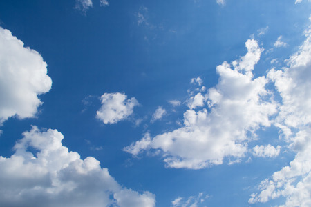 Cloudy cumulus, medium, high in the blue sky backgroundの写真素材