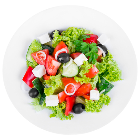 Greek salad with cheese in plate isolated on whiteの写真素材