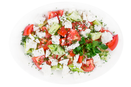 Tasty and nutritious Fresh salad with tomatoes, cucumbers, feta cheese and olive oilの写真素材